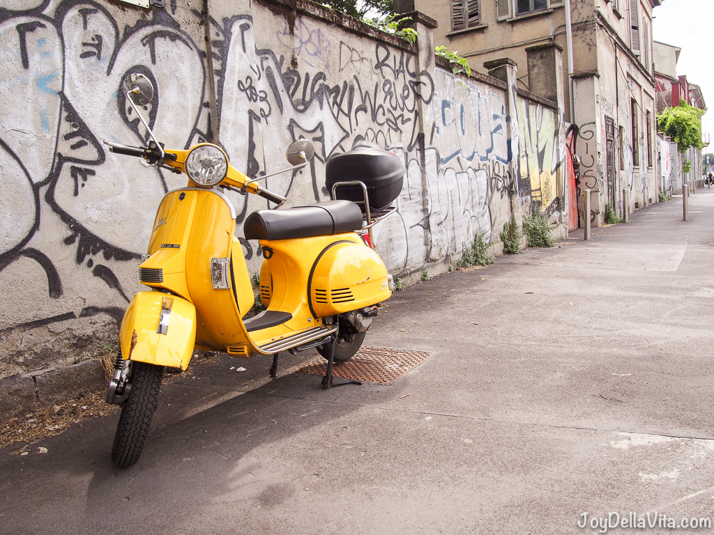 vintage yellow Vespa in Navigli Milan