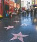 Walking along Walk of Fame on Hollywood Boulevard Los Angeles
