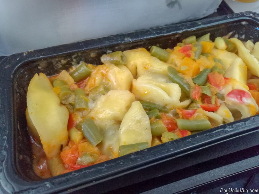 Qatar Airways Economy Meal: Mushroom Tortellini with Tomato & Olive Sauce, Vegetable mix & cheese sauce