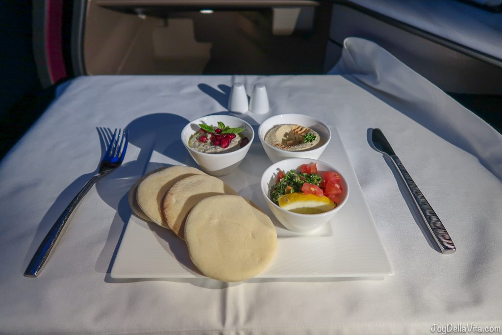 Arabic mezze plate with Hummus Tabbouleh Baba Ghanoush Qatar Airways Qsuite Business Class