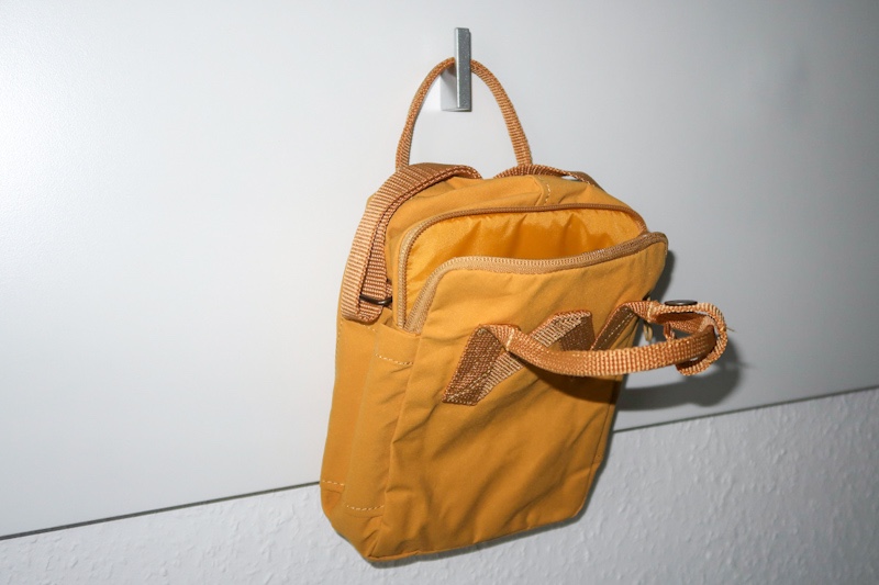 the backside of the fjallraven kanken sling with the small handles