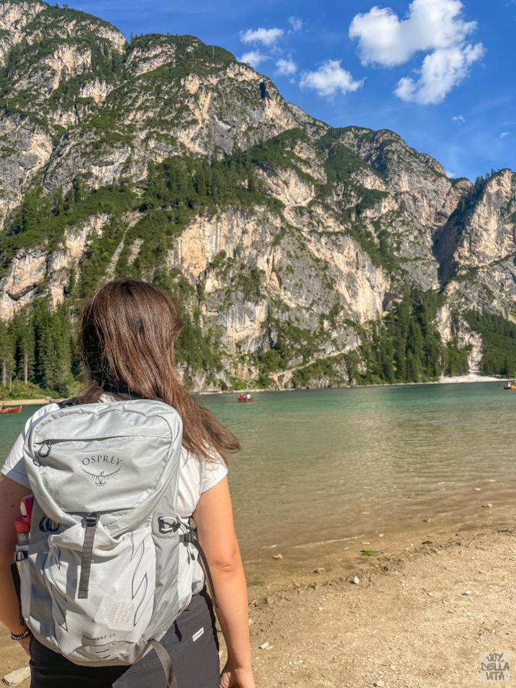Woman hiking once around Pragser Wildsee Lago di Braies Lake Dolomites